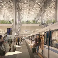 Nowoczesny dworzec kolejowy, idealny do podróży do Wrocławia. Ludzie z bagażami wsiadają do pociągu.