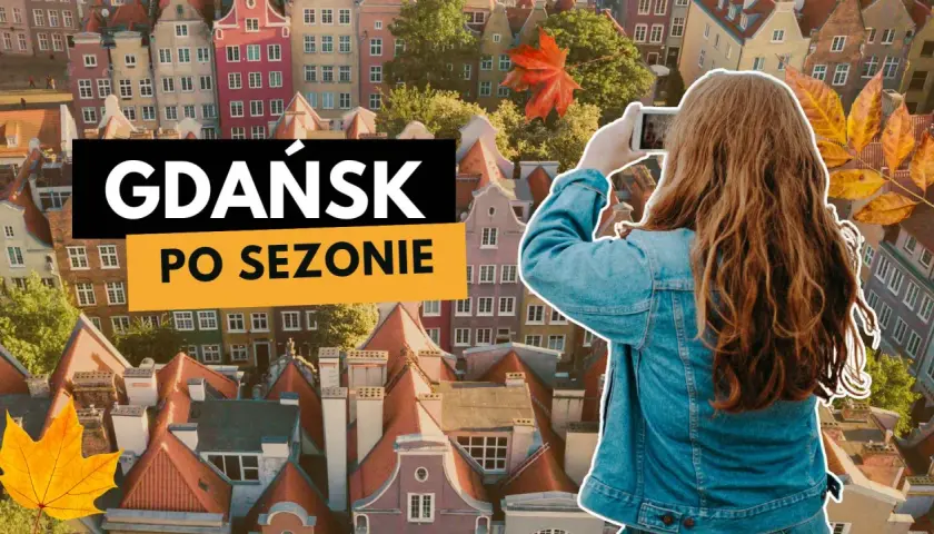 Dziewczyna robi zdjęcie jesiennego Gdańska. W tle kolorowe kamienice i liście.